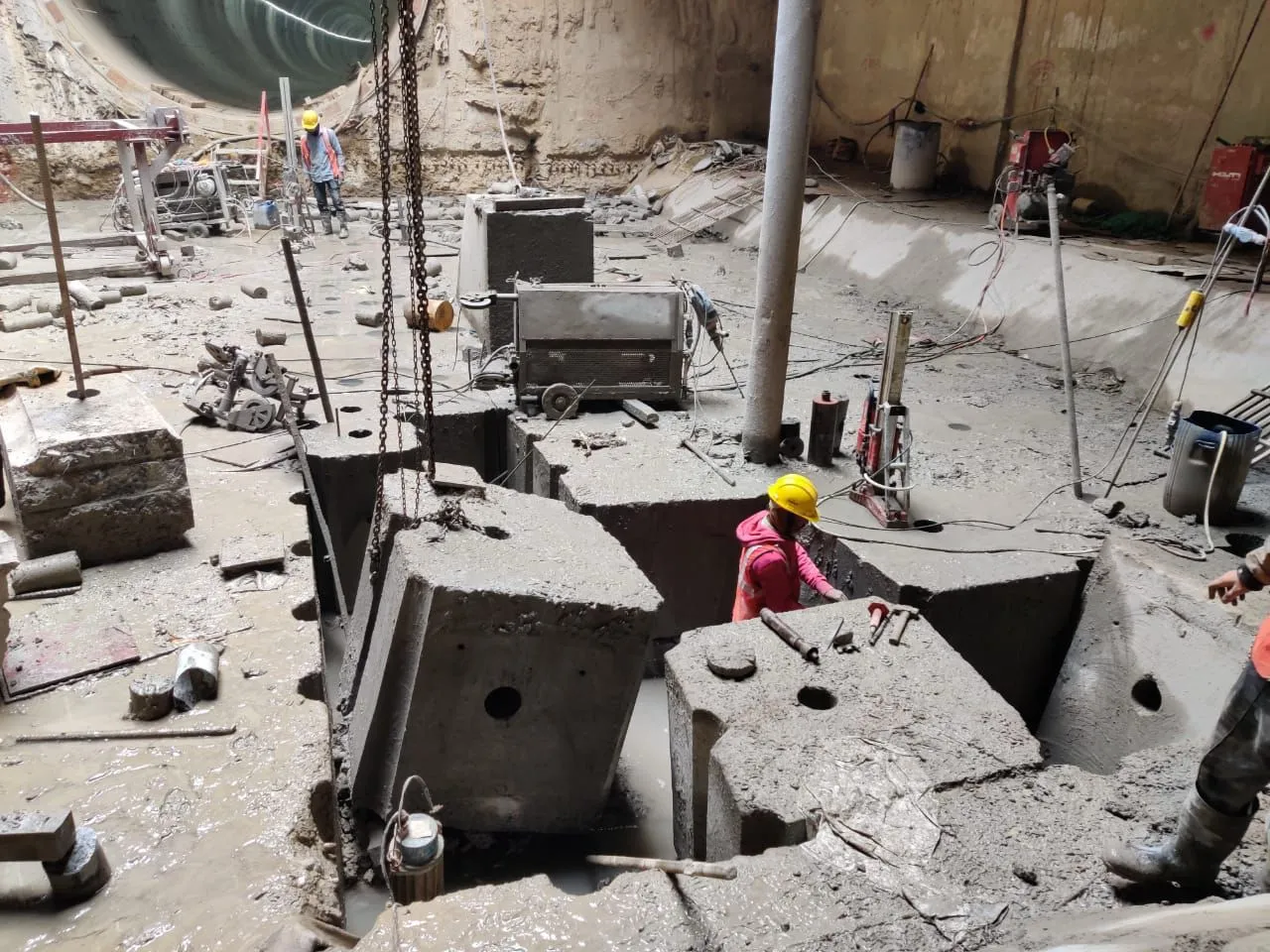 Large concrete blocks cut by wire saw waiting to be lifted from a pit